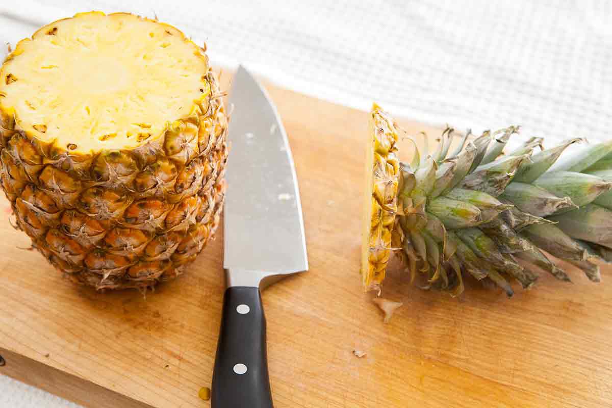 stand the pineapple upright after cutting off the top