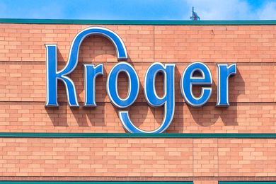 A Kroger sign on a brick building