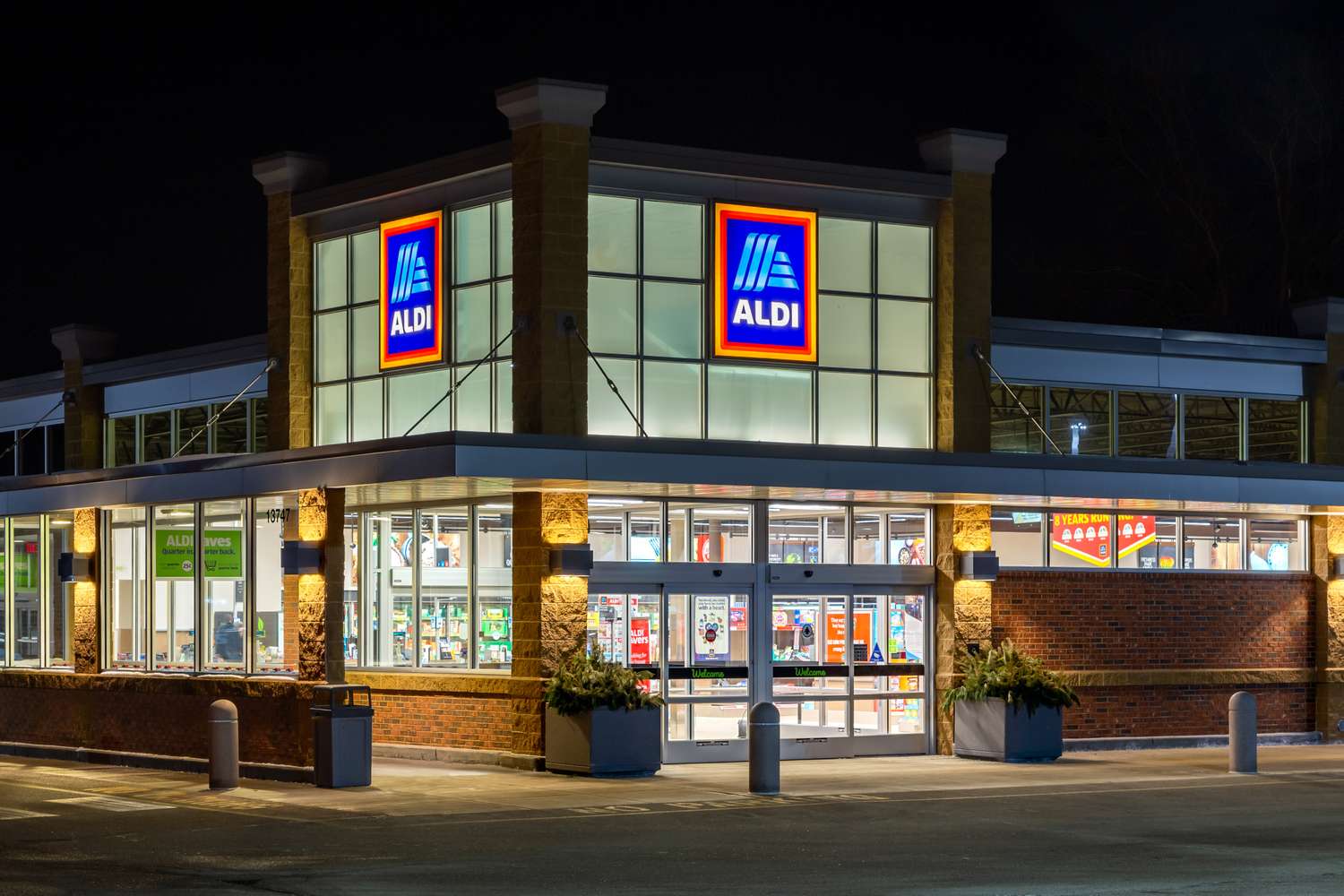 Exterior of an Aldi storefront illuminated at night