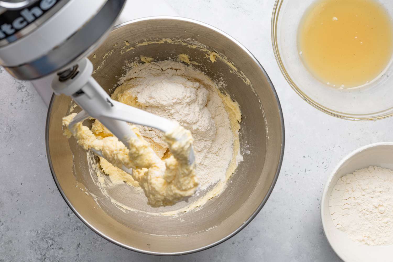 Corn Syrup Mixture and Flour Added to Whipped Butter in a Mixer