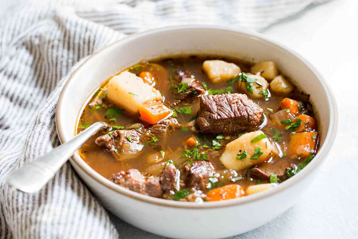 Irish Beef Stew in a bowl with a spoon
