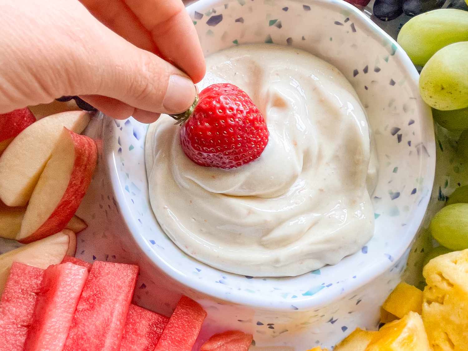strawberry dipped in the 2-ingredient dip