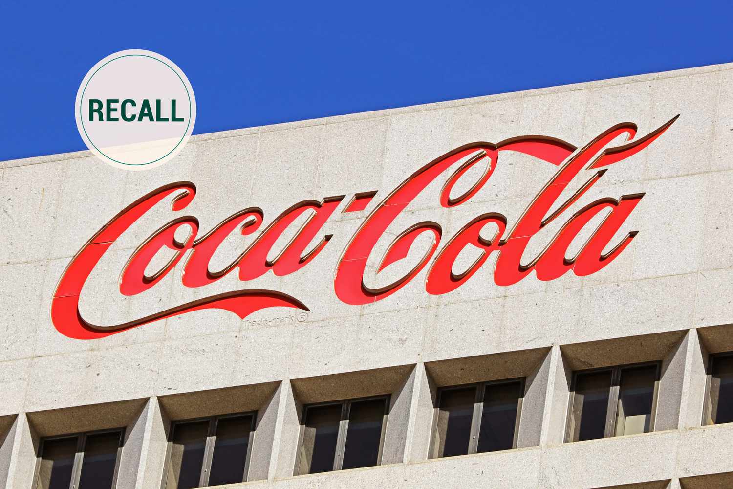 Coca Cola logo with a recall graphic over top