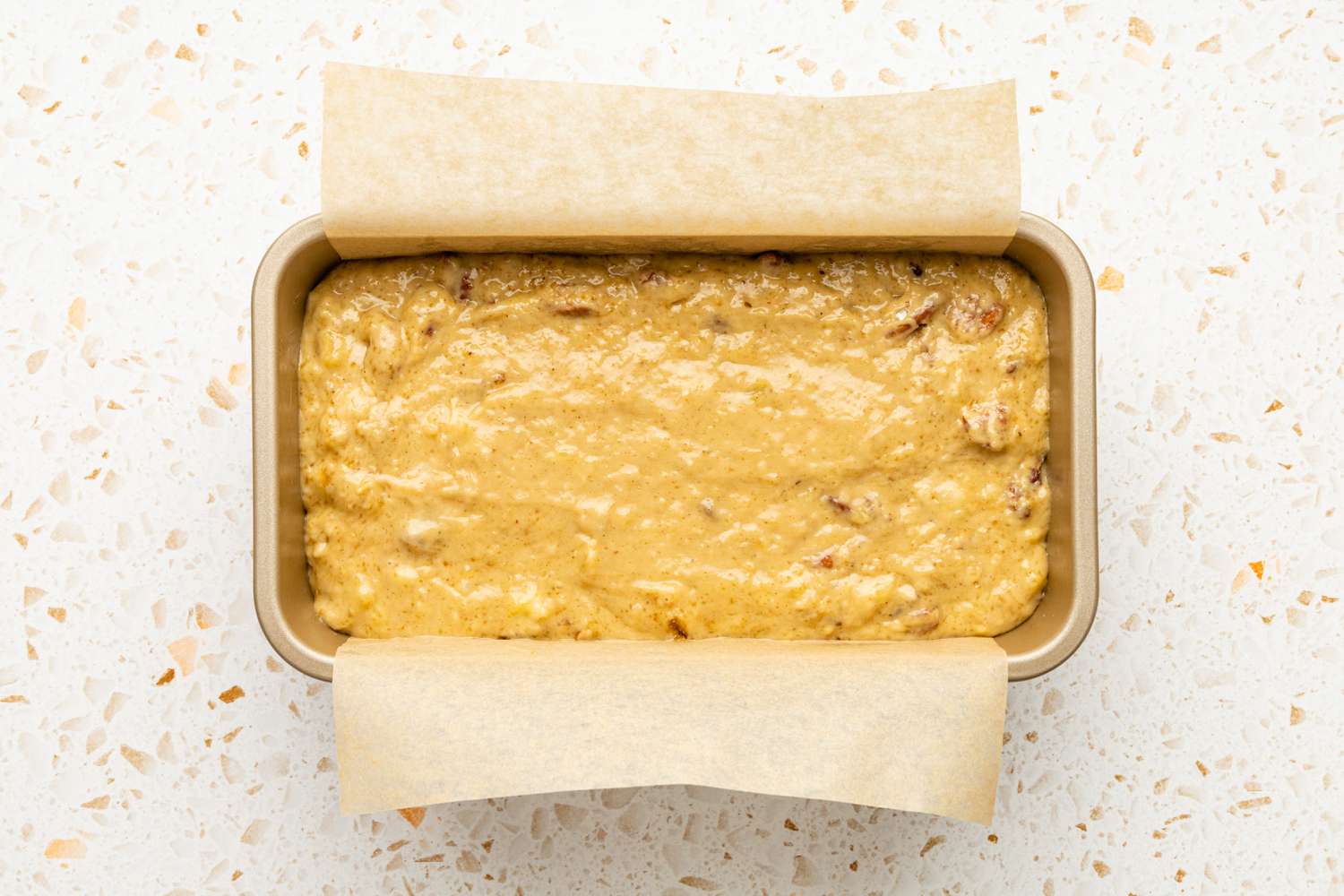 Banana Pecan Bread Batter in the Parchment Lined Loaf Pan
