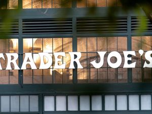 Trader Joe's sign on a storefront window and entryway