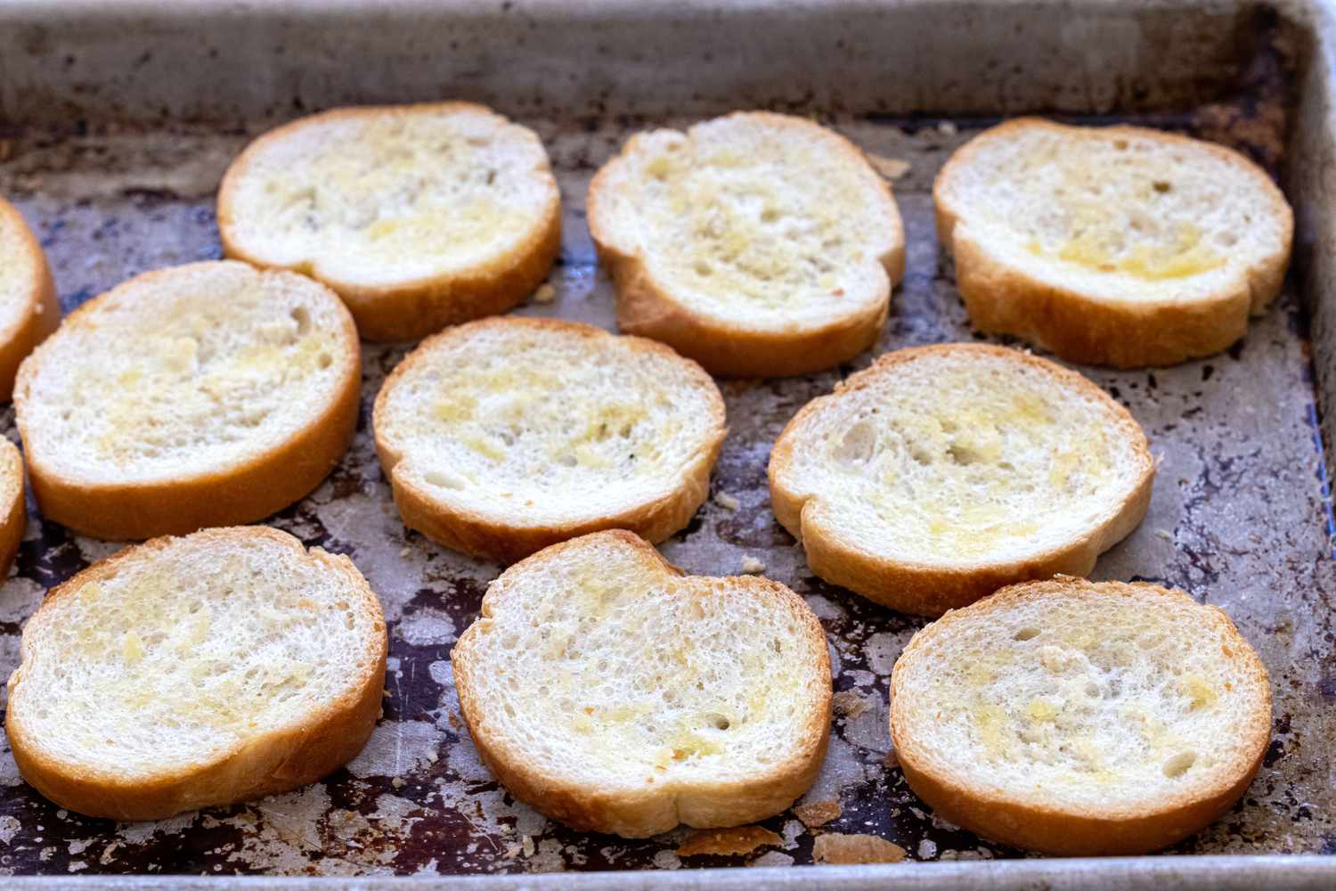 Baking the toasts for mushroom, onion, and goat cheese crostini.