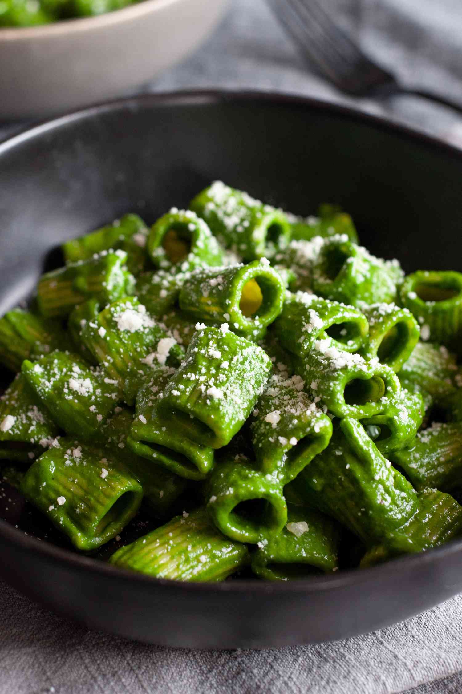 Swiss chard, lemon, and parmesan pasta heaped in a low bowl.