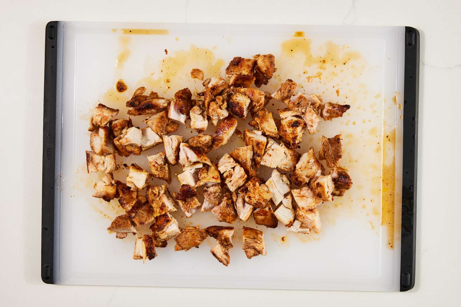 Cubed copycat Chipotle chicken on a cutting board