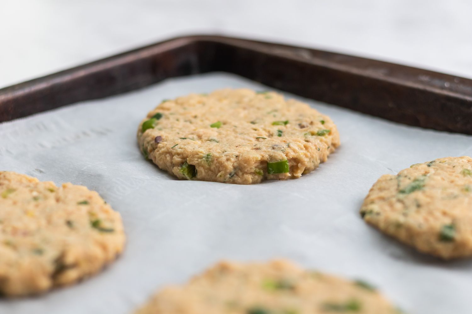 How to make salmon cakes and portioned on parchment paper.